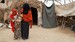 Marina with her two children in the settlement for IDPs in Abyan