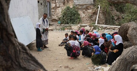 Young students study under trees in Sarar District of Abyan Governorate, Yemen